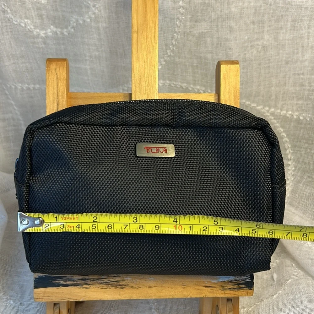 TUMI new never used cosmetic bag with some goodies
